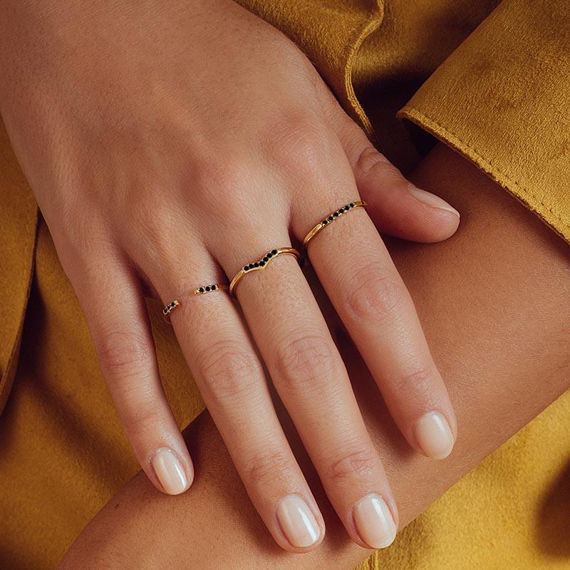 thin black diamond rings in yellow gold