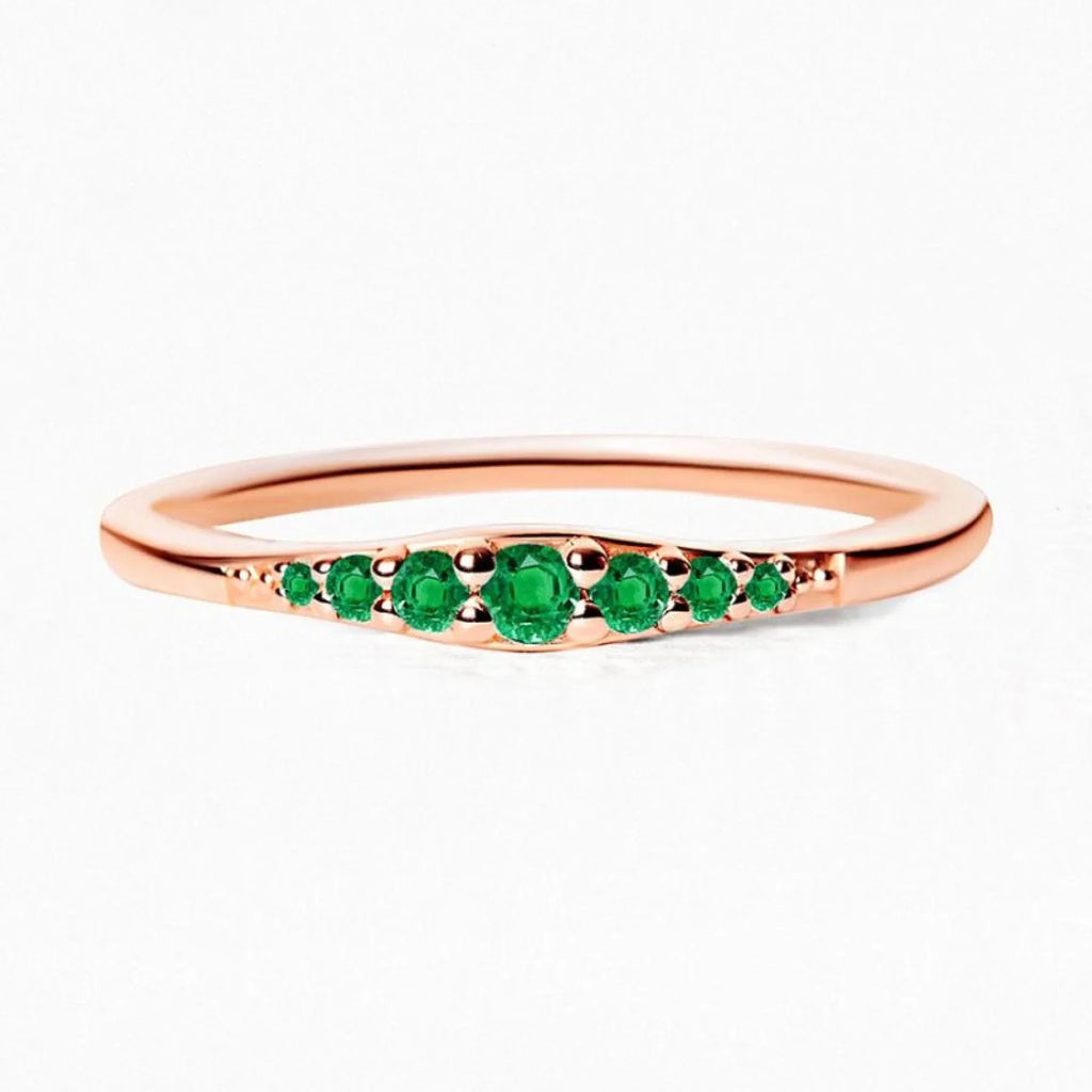 A rose gold and emerald ring, an unexpected combination that transcends convention