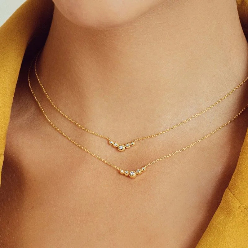 Mayuri 18K gold diamond necklace featuring a solitaire pendant