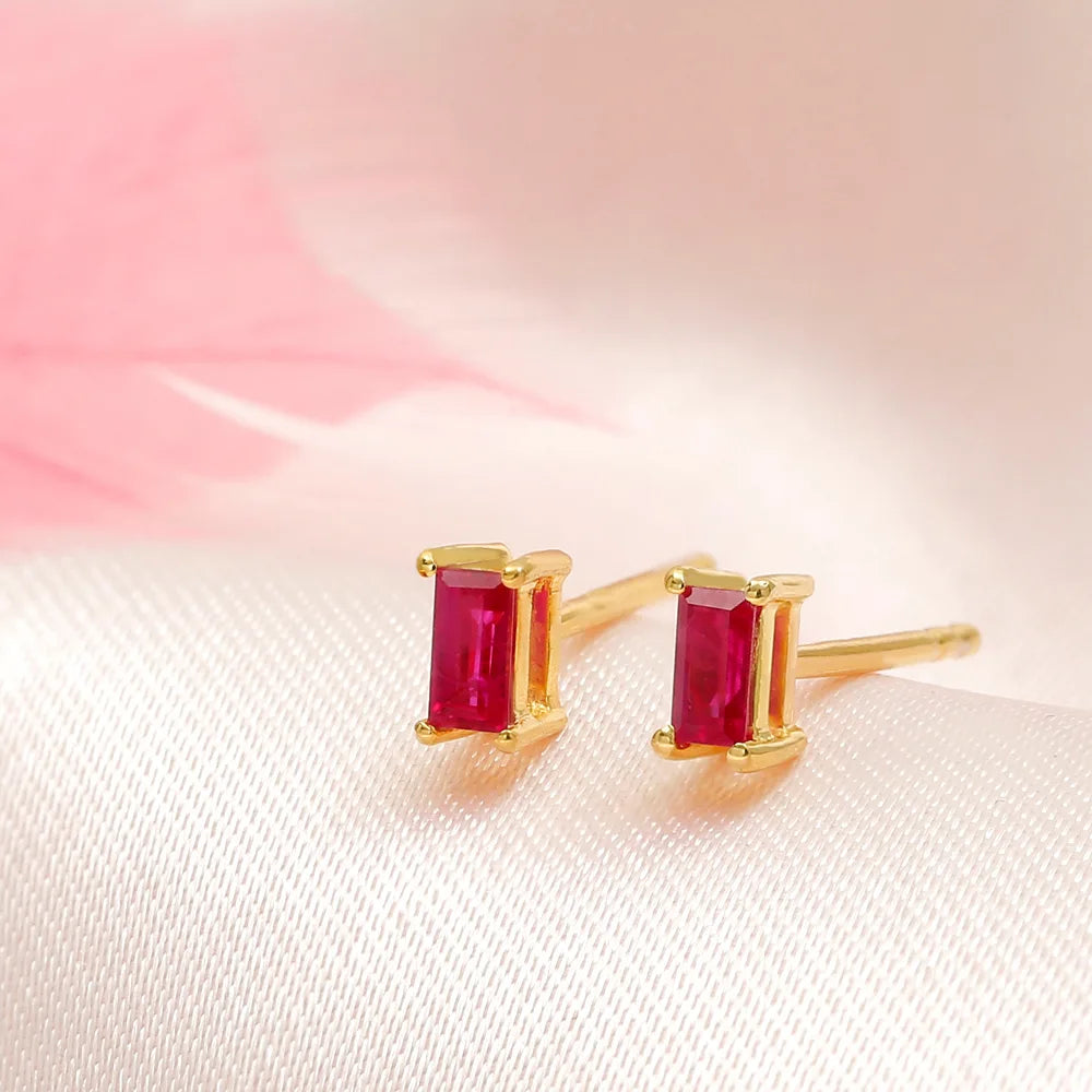 Ruby baguette stud earrings in 18K yellow gold by Mayuri