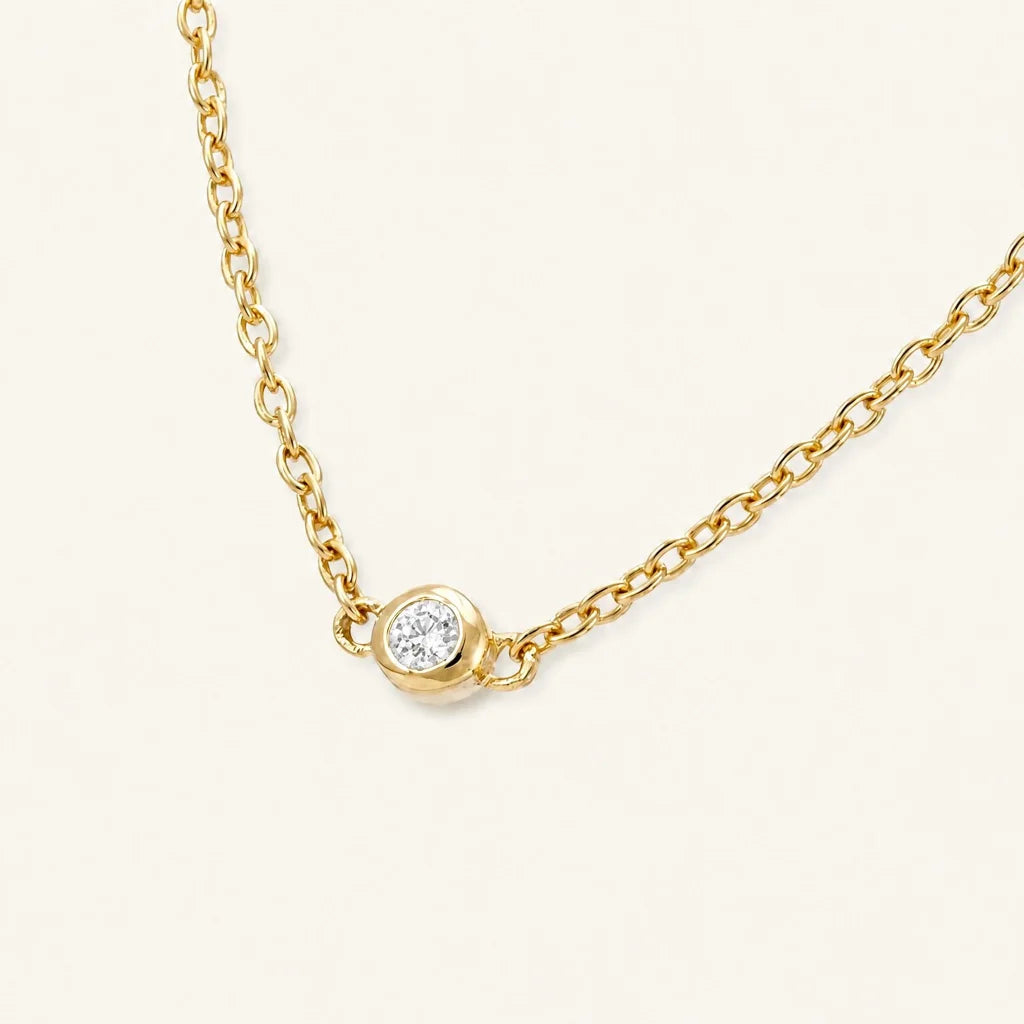 The Asonya necklace in 18K yellow gold with a bezel-set diamond, by Mayuri