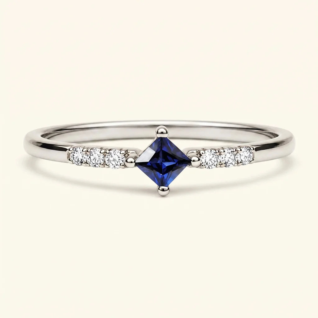 Kali ring with princess cut sapphire and diamond pavé in white gold by Mayuri