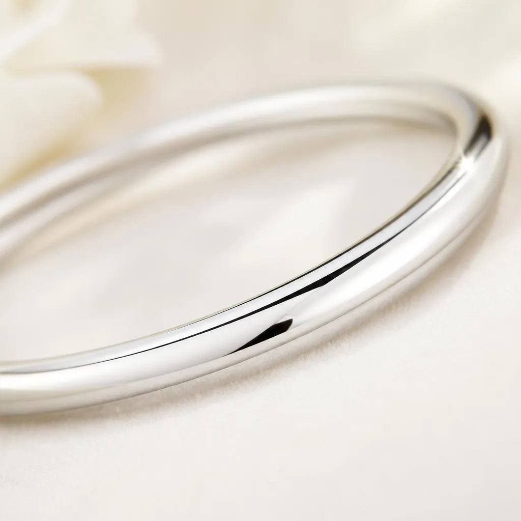 Close-up of a polished 925 silver bangle shining after cleaning
