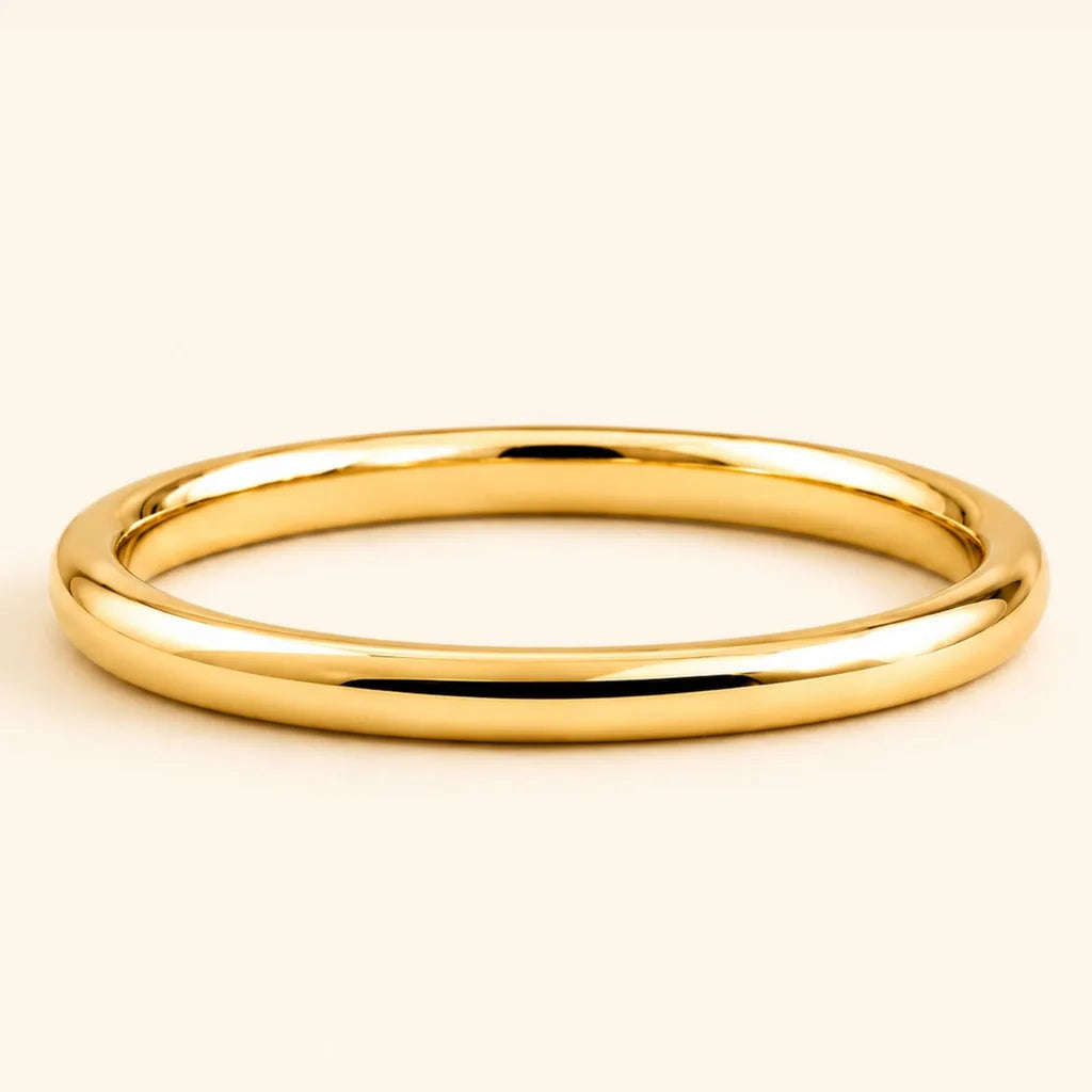 Shunya round band wedding ring in 18K yellow gold with a high-polish finish, by Mayuri