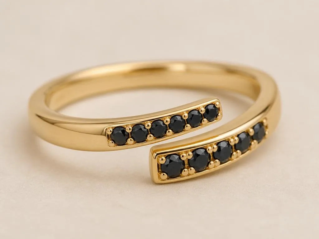 Modern ring in 18K yellow gold set with black diamonds, a contemporary contrast between warm gold and opaque stones