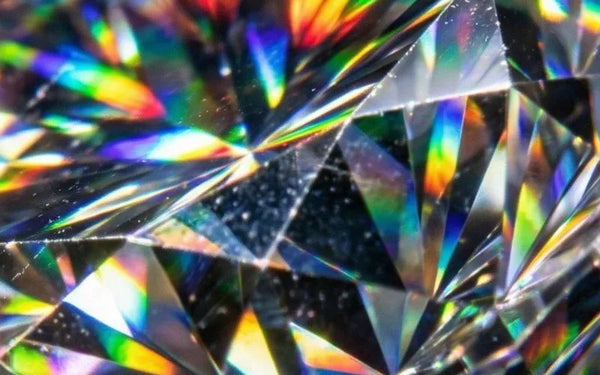 Macro of a brilliant-cut diamond showing its 57 facets and the dispersion of light