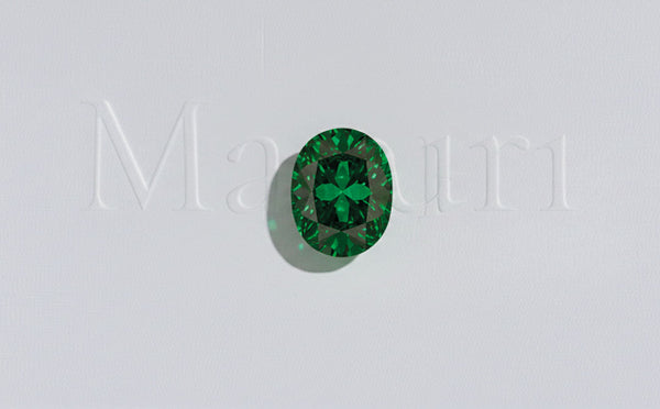 Intense green oval-cut emerald, May birthstone, fine and precious jewellery