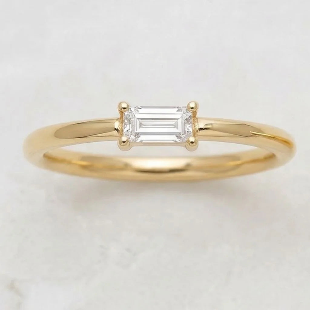 Emerald cut diamond solitaire ring in 18K yellow gold, top view