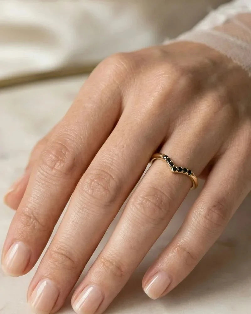 Mayuri black diamond engagement ring worn on a woman's hand