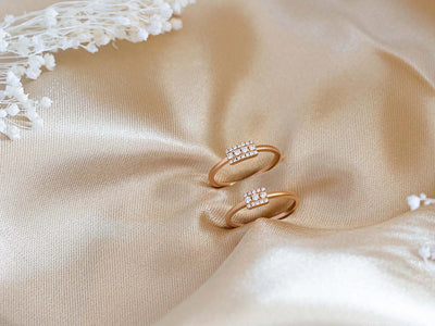 Mayuri diamond wedding bands in 18K gold on golden satin