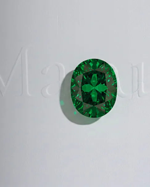 Intense green oval-cut emerald, May birthstone, fine and precious jewellery
