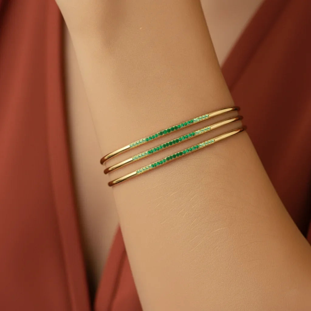 Tarang Canopée tsavorite bangle by Mayuri in 18K gold, worn at the wrist