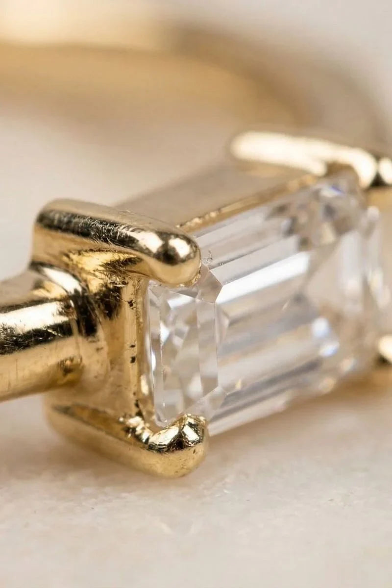 Ultra-macro of the prongs on a diamond solitaire ring, checking the setting