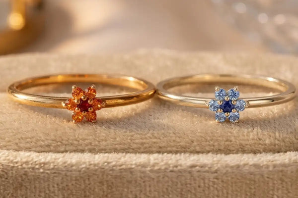 Flower ring in 18K yellow gold set with orange sapphires and a central ruby, Mayuri fine jewellery